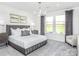Cozy main bedroom with natural light, a queen bed, and elegant decor at 1914 Sparkling Stream Dr # 057, Belmont, NC 28012