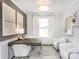 This home office features a large window, modern light fixture, and neutral-colored decor at 1914 Sparkling Stream Dr # 057, Belmont, NC 28012