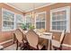 Sunlit dining room with multiple windows and cozy decor at 204 Sylvania Ave, Charlotte, NC 28206