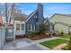 Charming blue brick home with landscaped yard and quaint architectural details at 204 Sylvania Ave, Charlotte, NC 28206
