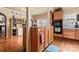 Kitchen with wooden cabinetry and a breakfast bar overlooking the kitchen at 204 Sylvania Ave, Charlotte, NC 28206