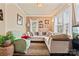Comfortable living room featuring a large sectional sofa and bright windows at 204 Sylvania Ave, Charlotte, NC 28206