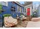 Inviting covered patio with comfortable seating, a fan, and unique decor at 204 Sylvania Ave, Charlotte, NC 28206