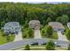 An aerial view showcases this lovely home nestled within a lush, tree-filled neighborhood at 2108 Clarion Dr, Fort Mill, SC 29707