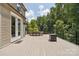 A backyard deck with a dining table and chairs, and room for outdoor dining and leisure activities at 2108 Clarion Dr, Fort Mill, SC 29707
