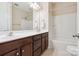 Bathroom with a double sink vanity, large mirror and tub with shower at 2108 Clarion Dr, Fort Mill, SC 29707