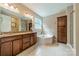 A full bathroom with a tub, a separate shower and cabinet storage at 2108 Clarion Dr, Fort Mill, SC 29707
