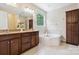 Bathroom with granite countertops, tub, tile floors, and storage at 2108 Clarion Dr, Fort Mill, SC 29707