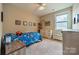 A colorful bedroom featuring a fan and a dresser at 2108 Clarion Dr, Fort Mill, SC 29707