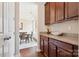 Convenient butler's pantry with ample cabinet space and granite countertops connecting to the dining area at 2108 Clarion Dr, Fort Mill, SC 29707