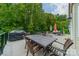 Spacious outdoor deck perfect for entertaining with a large dining table and a grill at 2108 Clarion Dr, Fort Mill, SC 29707