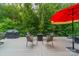 Modern deck with an outdoor kitchen and a seating area with a fire pit and chairs at 2108 Clarion Dr, Fort Mill, SC 29707