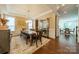 Bright dining room with a wooden table, bench seating, decorative chandelier, and stylish decor at 2108 Clarion Dr, Fort Mill, SC 29707