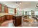 Bright kitchen with wood cabinets, stainless appliances, granite countertops, and breakfast bar seating at 2108 Clarion Dr, Fort Mill, SC 29707