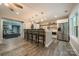 Spacious kitchen featuring a breakfast bar, stainless steel appliances, and modern pendant lighting at 2108 Clarion Dr, Fort Mill, SC 29707