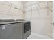 Functional laundry room with wire shelving and modern washer and dryer at 2108 Clarion Dr, Fort Mill, SC 29707