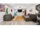Cozy living area with wood look floors, comfortable seating, and large TV at 2108 Clarion Dr, Fort Mill, SC 29707