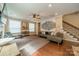 Stylish living room featuring hardwood floors, a comfortable sofa, and decorative artwork at 2108 Clarion Dr, Fort Mill, SC 29707