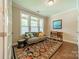 Cozy living room with hardwood floors, a comfortable sofa, and bright natural light at 2108 Clarion Dr, Fort Mill, SC 29707