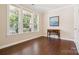 Bright office space with hardwood floors, large windows, and a classic desk, perfect for working from home at 2108 Clarion Dr, Fort Mill, SC 29707