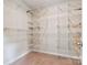 Large walk-in closet with custom white shelving and carpet flooring at 2108 Clarion Dr, Fort Mill, SC 29707