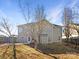 View of the home's rear exterior with a partially fenced yard at 215 Madelia Pl, Mooresville, NC 28115
