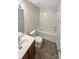 Neutral bathroom with updated vanity, mirror, toilet, and tub with shower in this home at 215 Madelia Pl, Mooresville, NC 28115