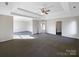 Spacious main bedroom with ceiling fan and trey ceiling at 215 Madelia Pl, Mooresville, NC 28115