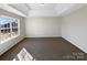 This spacious bedroom has a large window, carpet, and neutral walls at 215 Madelia Pl, Mooresville, NC 28115