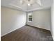 This bedroom features neutral walls, carpet, and a window for lots of natural light at 215 Madelia Pl, Mooresville, NC 28115
