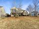 Charming two-story home with a well-manicured lawn and attractive landscaping at 215 Madelia Pl, Mooresville, NC 28115