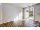 Bright sunroom featuring hardwood floors and sliding glass doors leading to a patio at 2260 Hedgecliff Rd # 163, Kannapolis, NC 28025