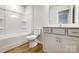 Clean bathroom featuring a tub/shower, toilet, and vanity with white cabinets at 2280 Hedgecliff Rd, Kannapolis, NC 28025