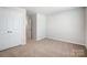 Bedroom featuring carpet floors, a closet and neutral walls, offering a blank canvas at 2280 Hedgecliff Rd, Kannapolis, NC 28025