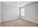 Comfortable bedroom with carpet floors, neutral walls and natural light from window at 2280 Hedgecliff Rd, Kannapolis, NC 28025