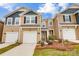 Beautiful townhome with a well-manicured lawn, two-car garage, and attractive curb appeal at 2280 Hedgecliff Rd, Kannapolis, NC 28025