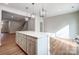 Bright kitchen with large island, pendant lighting, and hardwood floors at 2280 Hedgecliff Rd, Kannapolis, NC 28025
