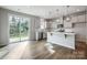 Beautiful kitchen with an island, stainless steel appliances, and a sliding glass door that leads to the yard at 2280 Hedgecliff Rd, Kannapolis, NC 28025