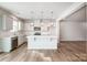 Bright kitchen with white cabinets, stainless steel appliances, and large center island at 2280 Hedgecliff Rd, Kannapolis, NC 28025