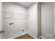 Small laundry room with tile flooring, storage and utility hookups at 2280 Hedgecliff Rd, Kannapolis, NC 28025