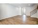 View of the living room with hardwood floors leading to the home's front entrance at 2280 Hedgecliff Rd, Kannapolis, NC 28025