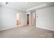 Spacious primary bedroom with neutral carpet and a walk-in closet and ensuite bathroom at 2280 Hedgecliff Rd, Kannapolis, NC 28025