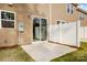Cozy outdoor patio with a sliding glass door and white privacy fence, perfect for relaxing or entertaining at 2280 Hedgecliff Rd, Kannapolis, NC 28025