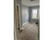 Cozy bedroom with carpet, light blue walls, natural light, and closet perfect for comfortable living at 2404 Booker Ave, Charlotte, NC 28216