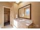 Bathroom features a single sink vanity, mirror, and floral wallpaper at 246 Jerry Crump Rd, Lincolnton, NC 28092