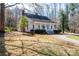 Charming white home with a welcoming front porch and mature trees at 246 Jerry Crump Rd, Lincolnton, NC 28092