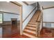 Foyer features staircase and hardwood floors leading to a room with fireplace at 246 Jerry Crump Rd, Lincolnton, NC 28092
