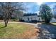 Charming white home with inviting front porch and mature landscaping at 246 Jerry Crump Rd, Lincolnton, NC 28092