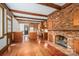Eat-in kitchen boasts brick fireplace, wood cabinets and stainless appliances at 246 Jerry Crump Rd, Lincolnton, NC 28092