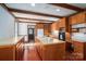 Kitchen features wood beam ceilings, island and stainless steel appliances at 246 Jerry Crump Rd, Lincolnton, NC 28092
